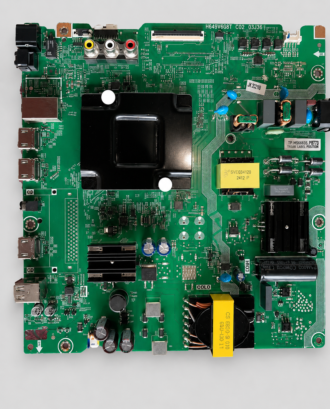 High-resolution TV mainboard (PCB) with multiple HDMI ports, AV inputs, capacitors, heat sink, and integrated power components displayed on a light gray background.