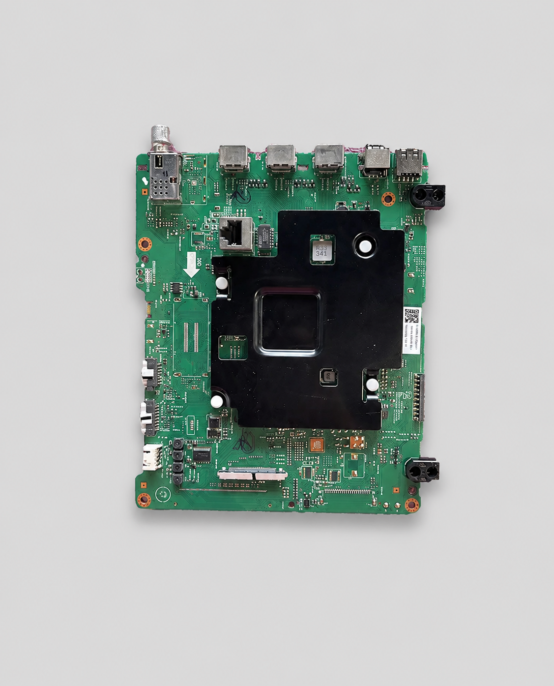 Green TV motherboard (main board) with multiple HDMI ports and electronic components displayed on a clean light gray background.