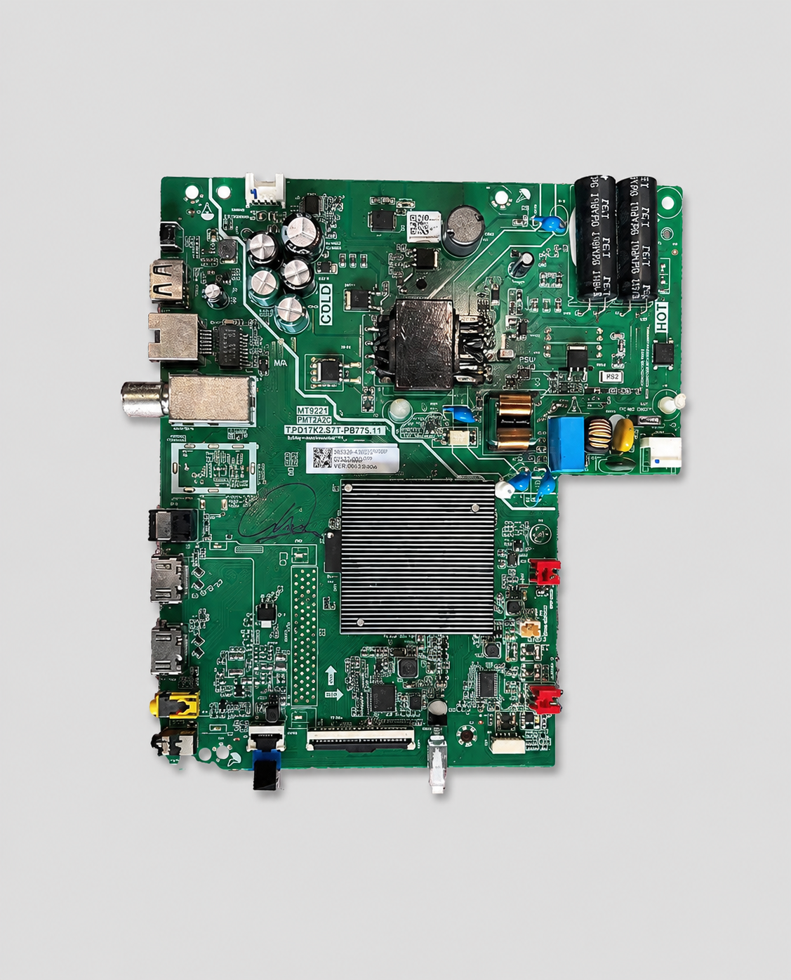 Green TV mainboard PCB with HDMI, USB, AV, and power components isolated on a light gray background.