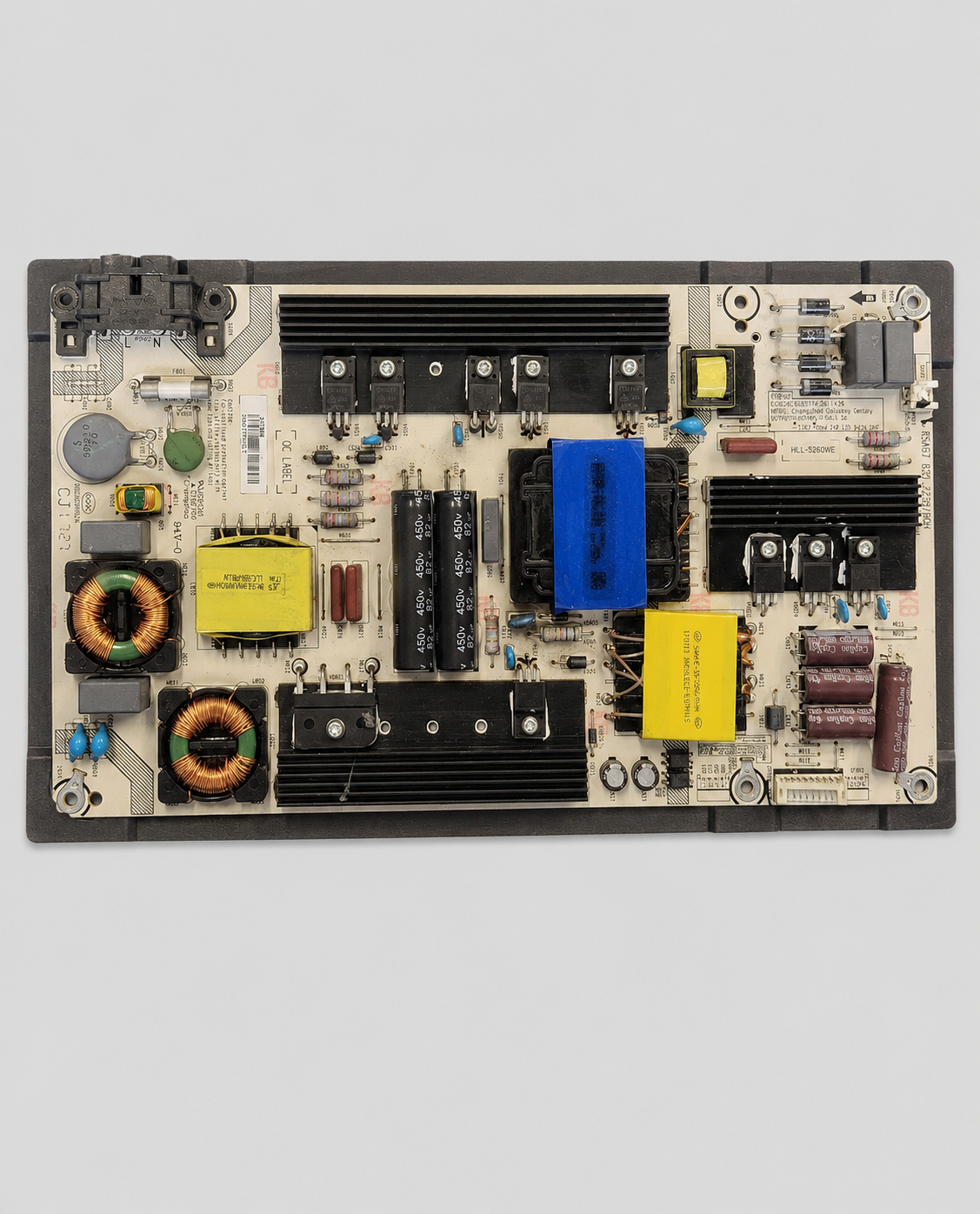 Power supply PCB board for LED Smart TV with transformers, capacitors, heat sinks, and electronic components displayed on a light gray background.